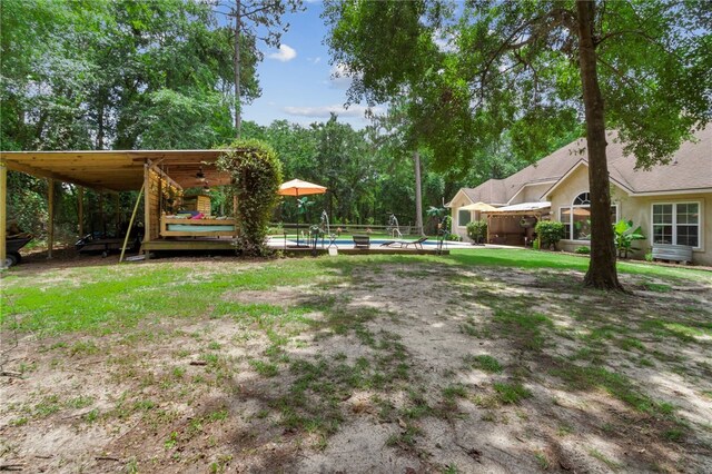 40 Jada Ln, Brunswick, GA 31523 - view of yard featuring an outdoor pool and a ceiling fan