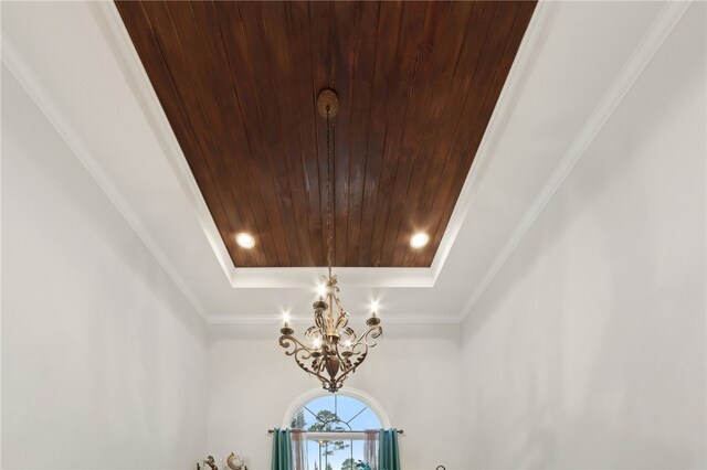40 Jada Ln, Brunswick, GA 31523 - detailed view of a chandelier, wooden ceiling, a tray ceiling, and ornamental molding