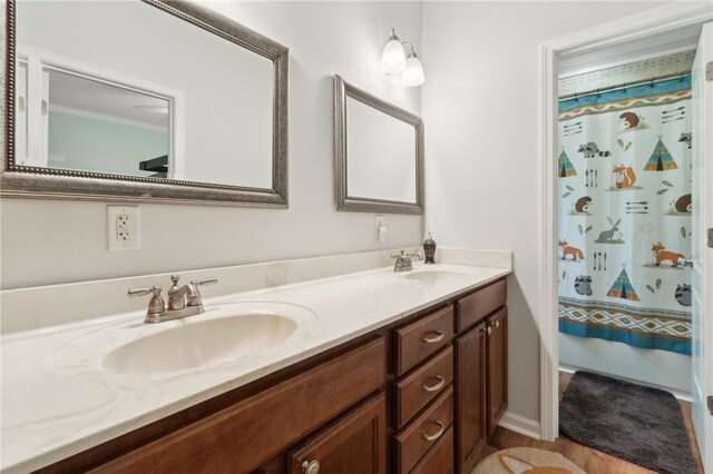 40 Jada Ln, Brunswick, GA 31523 - bathroom featuring double vanity and shower / bath combo with shower curtain