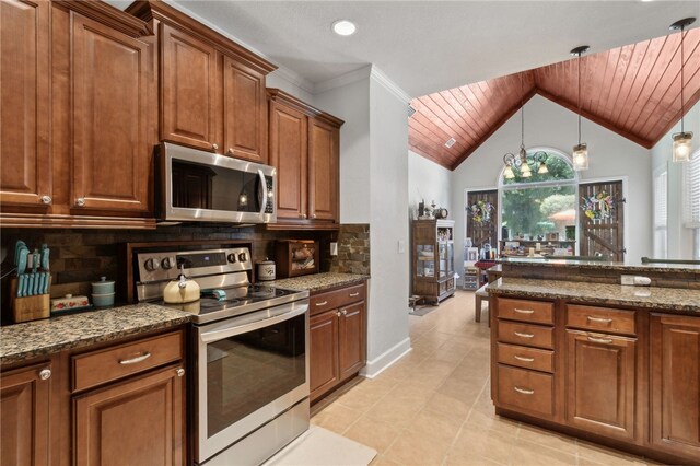 40 Jada Ln, Brunswick, GA 31523 - kitchen with appliances with stainless steel finishes, dark stone countertops, brown cabinetry, light tile patterned floors, and wooden ceiling