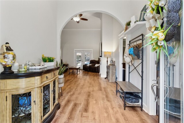 40 Jada Ln, Brunswick, GA 31523 - entryway with arched walkways, french doors, light wood finished floors, crown molding, and a ceiling fan