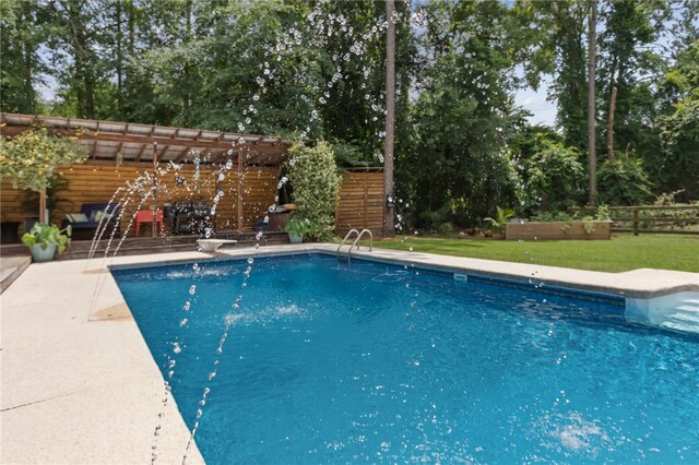 40 Jada Ln, Brunswick, GA 31523 - swimming pool with a pergola, view of wooded area, and a diving board