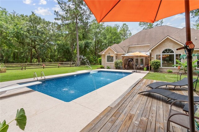 40 Jada Ln, Brunswick, GA 31523 - outdoor pool featuring a lawn, a patio, a gazebo, and a wooden deck