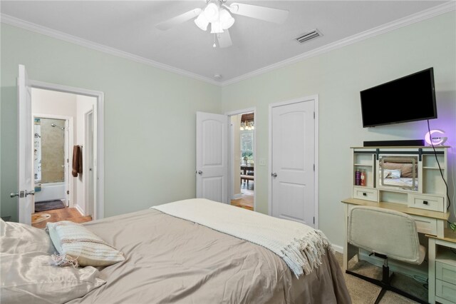 40 Jada Ln, Brunswick, GA 31523 - bedroom featuring crown molding, baseboards, ceiling fan, and connected bathroom