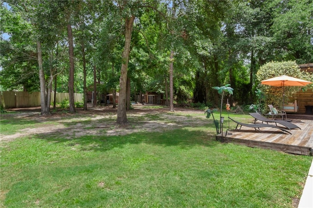 40 Jada Ln, Brunswick, GA 31523 - view of yard featuring a deck and an outbuilding