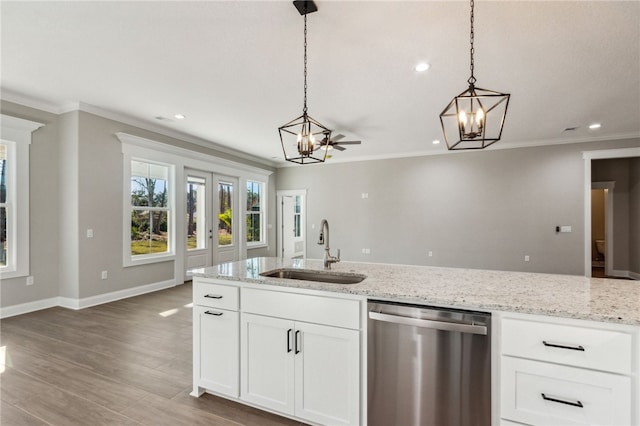 kitchen with a chandelier, decorative light fixtures, dishwasher, and a sink