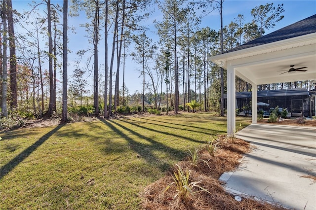 view of yard with ceiling fan