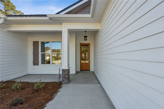 doorway to property with covered porch