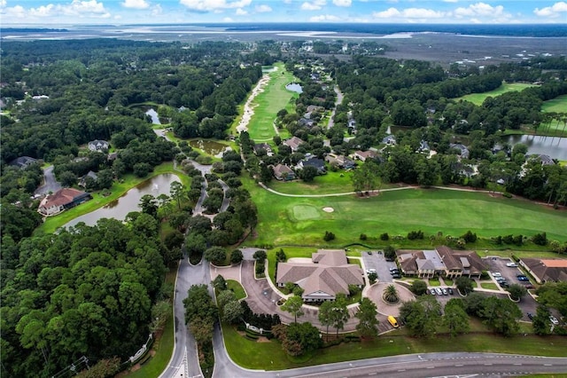 bird's eye view with a water view, view of golf course, and a wooded view