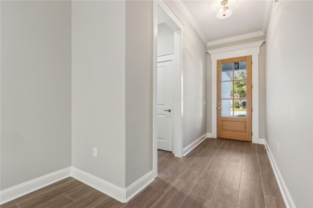 doorway to outside with crown molding, dark wood-type flooring, and baseboards