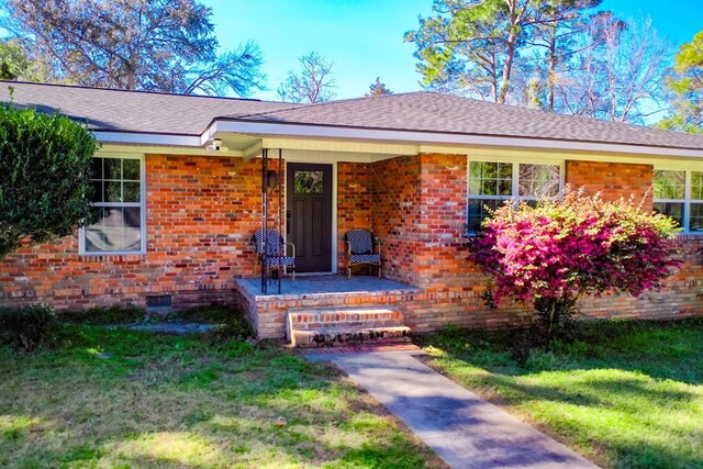 1625 Windsor Dr, Waycross, GA 31501 - view of front facade with crawl space, a front lawn, and brick siding