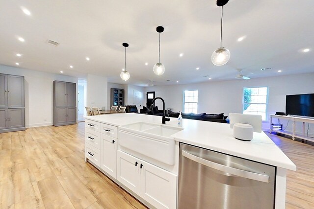 1625 Windsor Dr, Waycross, GA 31501 - kitchen featuring a sink, open floor plan, dishwasher, light wood finished floors, and visible vents