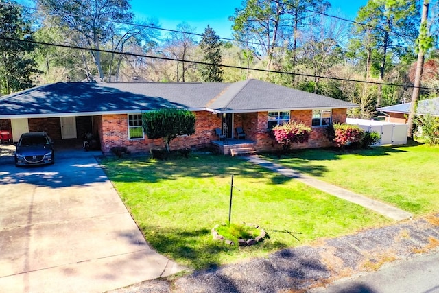 1625 Windsor Dr, Waycross, GA 31501 - single story home with fence, a front lawn, concrete driveway, a carport, and brick siding
