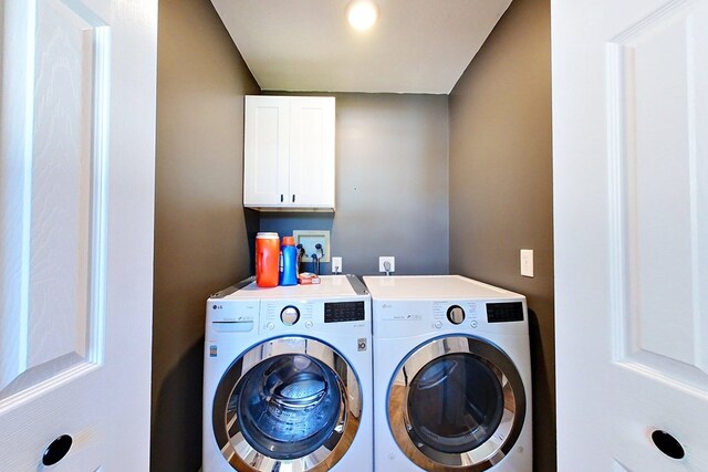 1625 Windsor Dr, Waycross, GA 31501 - laundry room with washing machine and dryer and cabinet space