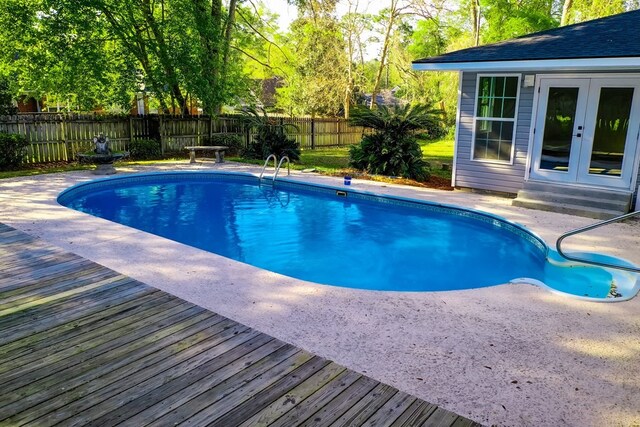 1625 Windsor Dr, Waycross, GA 31501 - view of swimming pool featuring a patio area, french doors, a fenced in pool, and a fenced backyard