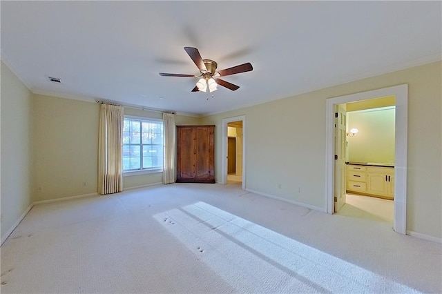 2227 Ware St, Blackshear, GA 31516 - unfurnished bedroom featuring baseboards, light colored carpet, ornamental molding, and connected bathroom