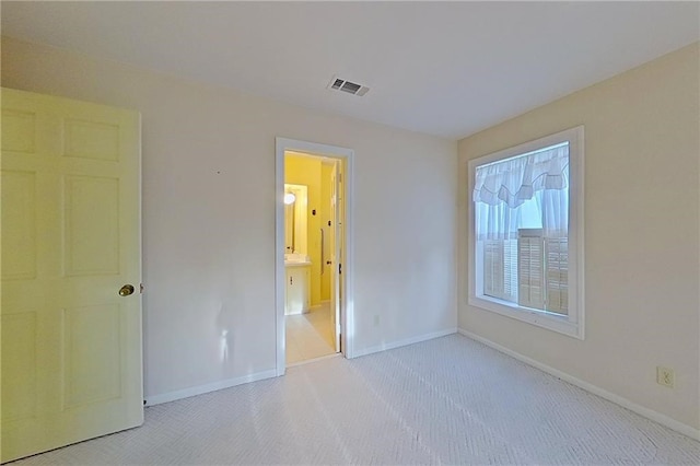 2227 Ware St, Blackshear, GA 31516 - unfurnished bedroom featuring carpet, baseboards, and connected bathroom