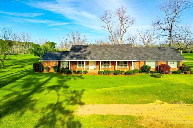 2227 Ware St, Blackshear, GA 31516 - ranch-style home featuring a front lawn and brick siding