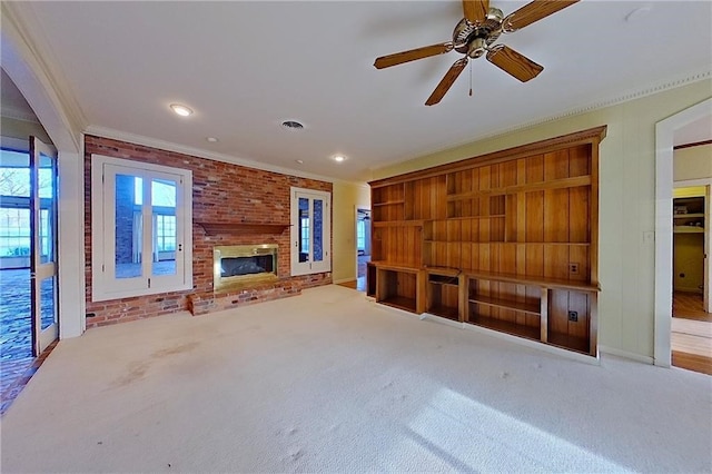2227 Ware St, Blackshear, GA 31516 - unfurnished living room featuring ornamental molding, carpet flooring, a brick fireplace, ceiling fan, and recessed lighting