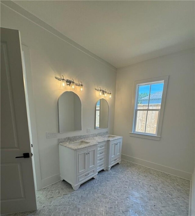 1912 First Ave, Saint Simons Island, GA 31522 - full bath featuring double vanity and baseboards