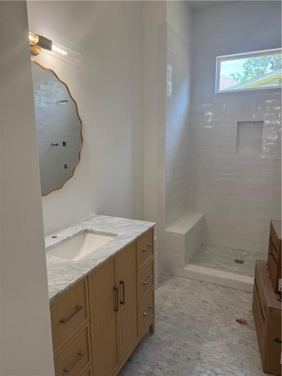 1912 First Ave, Saint Simons Island, GA 31522 - bathroom featuring vanity and tiled shower