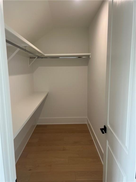 1912 First Ave, Saint Simons Island, GA 31522 - walk in closet with wood finished floors and lofted ceiling