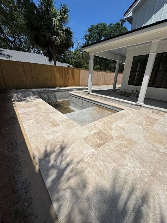 1912 First Ave, Saint Simons Island, GA 31522 - fenced backyard with a patio area
