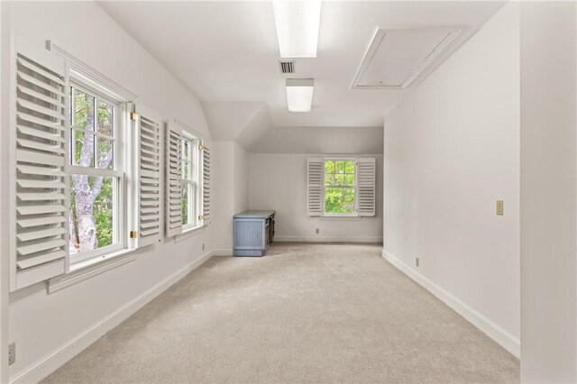 bonus room with attic access, visible vents, carpet flooring, and baseboards