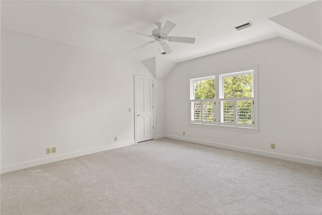 bonus room with vaulted ceiling, visible vents, light carpet, baseboards, and ceiling fan