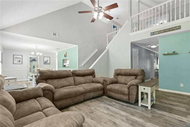 107 Tori Dr, Saint Marys, GA 31558 - living area with high vaulted ceiling, a chandelier, ceiling fan, baseboards, and wood finished floors