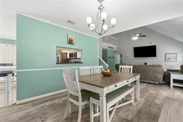 107 Tori Dr, Saint Marys, GA 31558 - living area with high vaulted ceiling, a chandelier, ceiling fan, baseboards, and wood finished floors