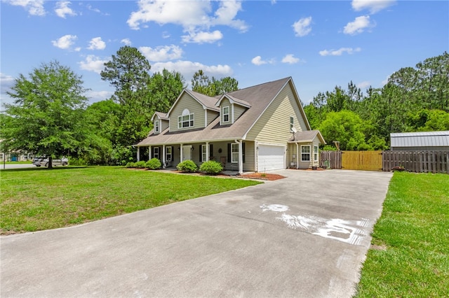 107 Tori Dr, Saint Marys, GA 31558 - new england style home with concrete driveway, a porch, and an attached garage