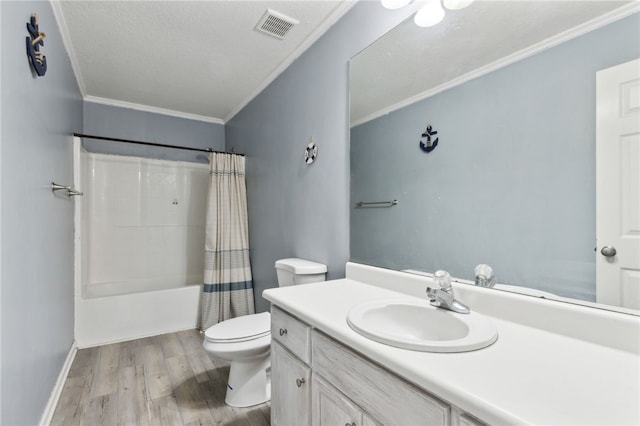 107 Tori Dr, Saint Marys, GA 31558 - full bath with crown molding, toilet, wood finished floors, vanity, and shower / bath combo with shower curtain