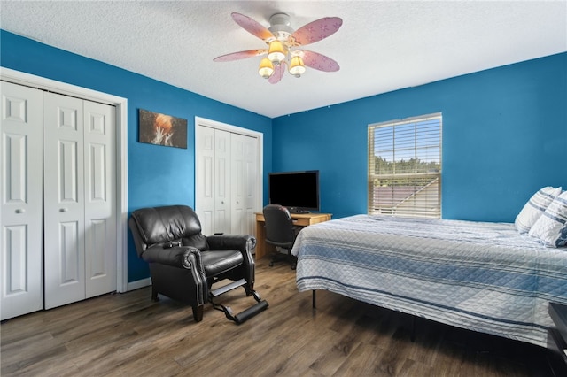 107 Tori Dr, Saint Marys, GA 31558 - bedroom featuring two closets, wood finished floors, ceiling fan, and a textured ceiling