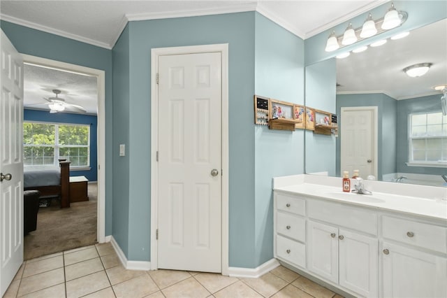 107 Tori Dr, Saint Marys, GA 31558 - bathroom featuring tile patterned floors, crown molding, vanity, baseboards, and a ceiling fan
