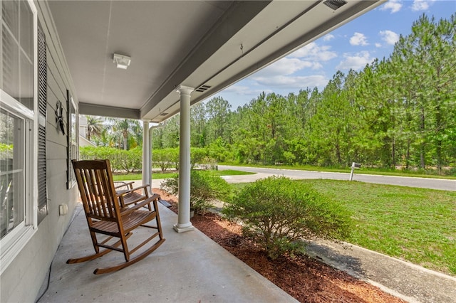 107 Tori Dr, Saint Marys, GA 31558 - view of patio with a porch and a forest view
