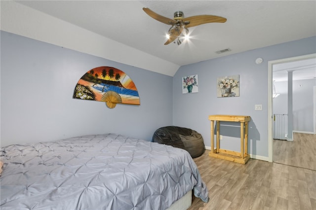 107 Tori Dr, Saint Marys, GA 31558 - bedroom with wood finished floors, vaulted ceiling, baseboards, and a ceiling fan