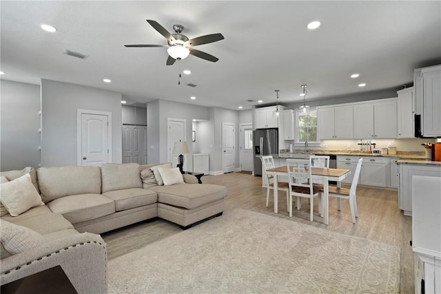 502 Ridge Rd, Darien, GA 31305 - living room with a ceiling fan, recessed lighting, light wood-style floors, and baseboards