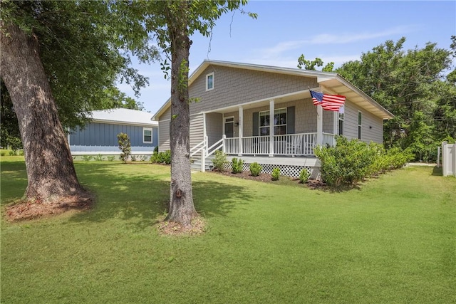 502 Ridge Rd, Darien, GA 31305 - view of front facade with a porch and a front lawn