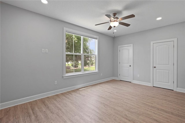 502 Ridge Rd, Darien, GA 31305 - unfurnished bedroom featuring light wood-type flooring, two closets, baseboards, recessed lighting, and ceiling fan