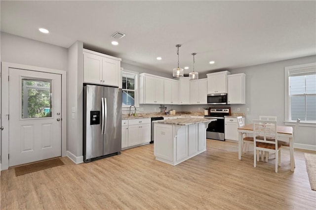 502 Ridge Rd, Darien, GA 31305 - kitchen featuring stainless steel appliances, plenty of natural light, light wood-style flooring, and recessed lighting