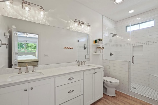 502 Ridge Rd, Darien, GA 31305 - full bath with ensuite bath, wood finished floors, toilet, a shower stall, and double vanity