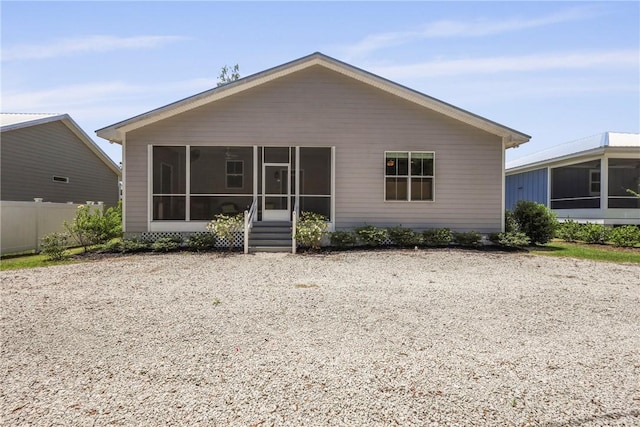 502 Ridge Rd, Darien, GA 31305 - back of house with a sunroom and fence