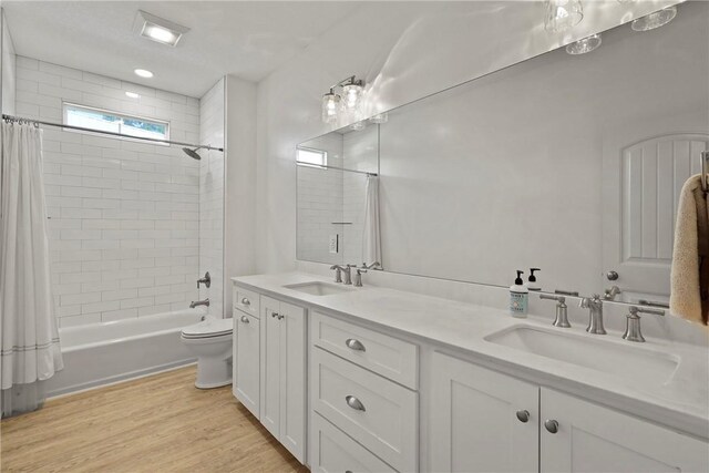 502 Ridge Rd, Darien, GA 31305 - full bath with wood finished floors, toilet, double vanity, and shower / bath combo