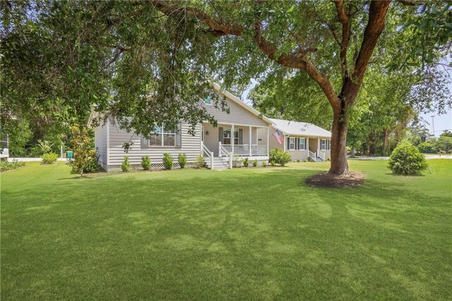 502 Ridge Rd, Darien, GA 31305 - view of front of house featuring covered porch and a front yard