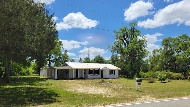 ranch-style home with a front lawn