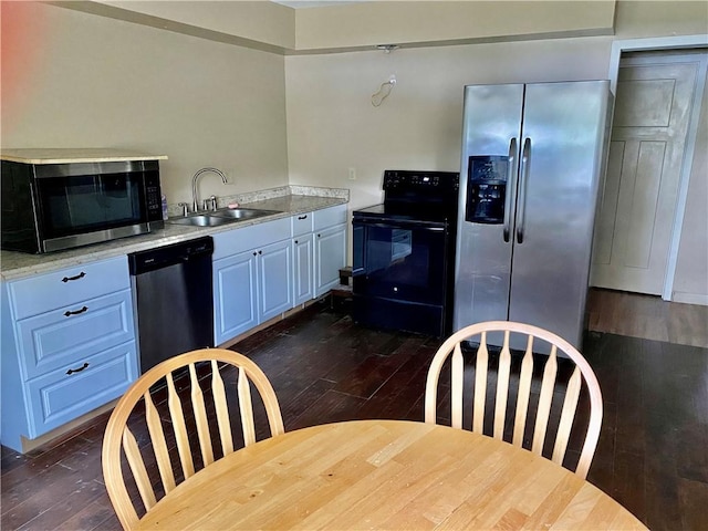 126 Lake View Cir, Brunswick, GA 31525 - kitchen featuring appliances with stainless steel finishes, dark wood-style floors, a sink, and light countertops