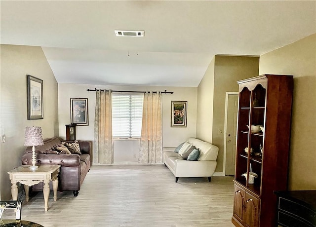 126 Lake View Cir, Brunswick, GA 31525 - sitting room with vaulted ceiling, light wood-type flooring, and baseboards