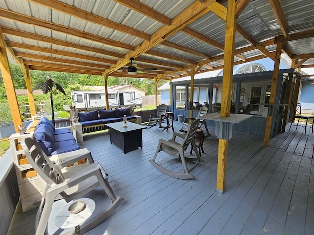 300 Crestview Dr, Woodbine, GA 31569 - deck with an outdoor living space and an outbuilding