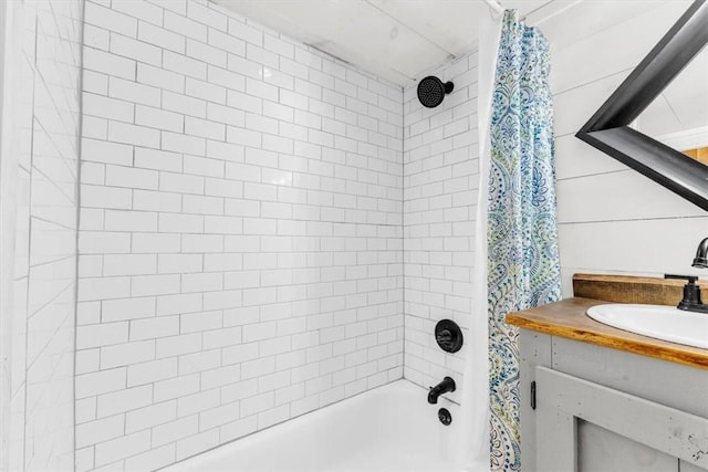 full bathroom featuring vanity and shower / bath combo with shower curtain
